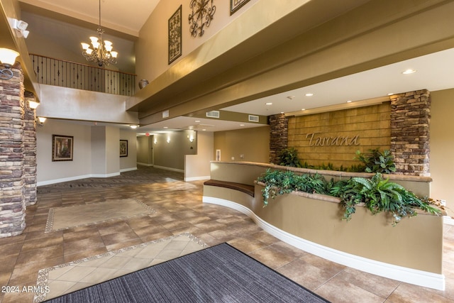 reception area featuring visible vents and an inviting chandelier