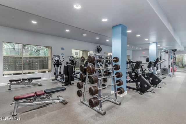 exercise room with baseboards and recessed lighting