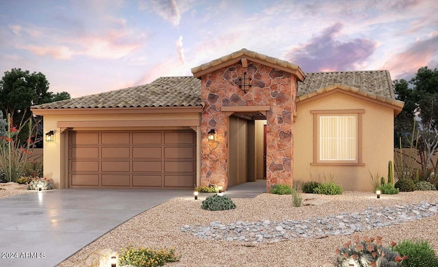 mediterranean / spanish-style home featuring a garage