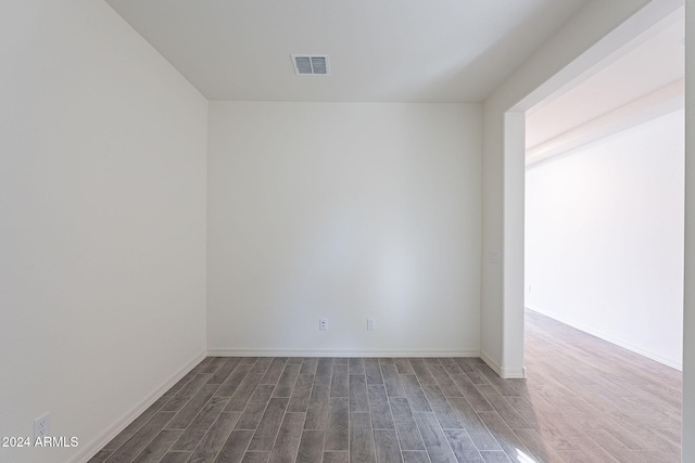 empty room featuring dark hardwood / wood-style floors