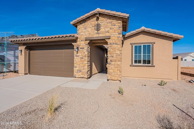 view of front of property with a garage