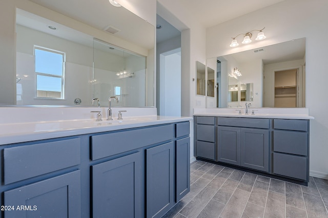 bathroom with vanity and hardwood / wood-style flooring