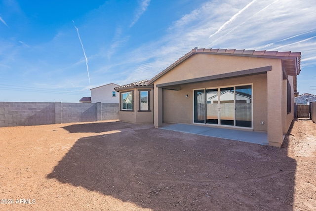 rear view of house featuring a patio area