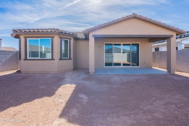 rear view of house featuring a patio