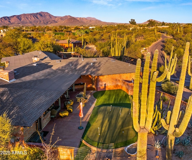 birds eye view of property featuring a mountain view