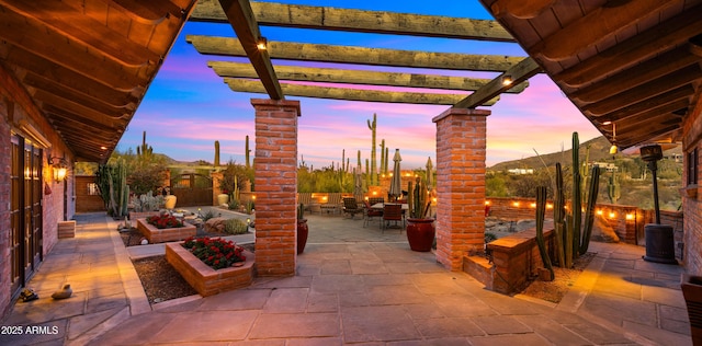 view of patio / terrace with outdoor dining space, a vegetable garden, fence, and a pergola