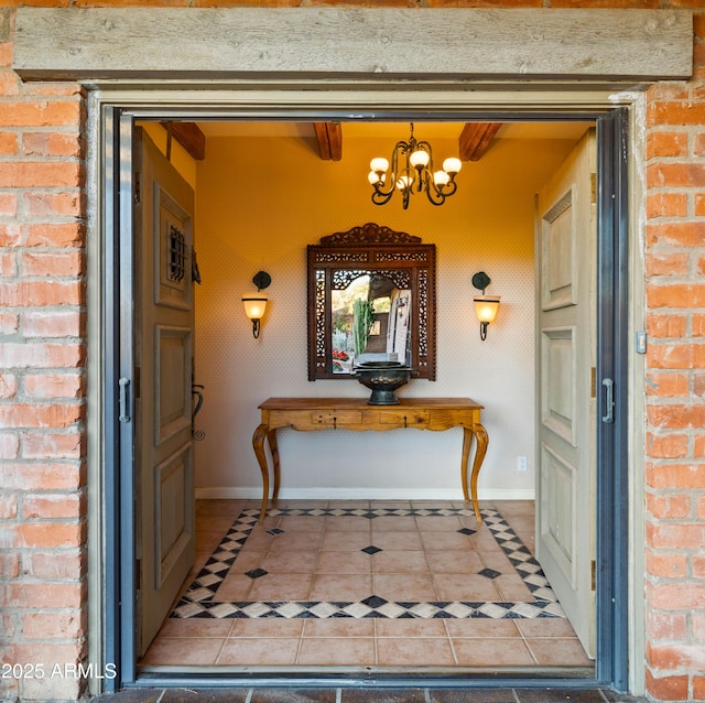 doorway to property featuring brick siding