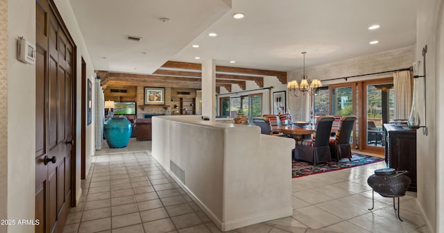 living room featuring an inviting chandelier, light tile patterned floors, visible vents, and recessed lighting