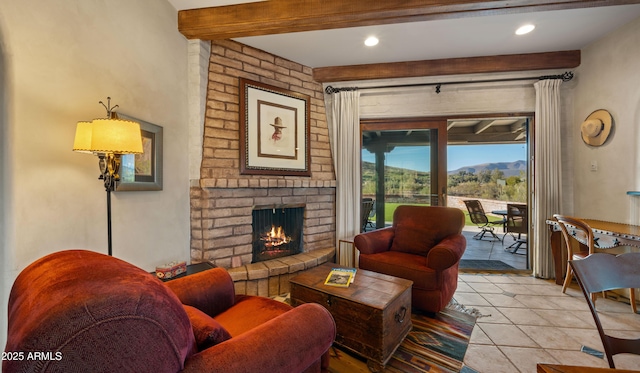 living area with light tile patterned floors, a brick fireplace, beam ceiling, and recessed lighting