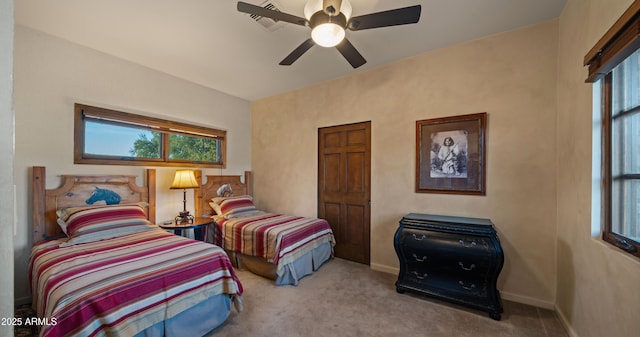 bedroom with carpet flooring, a ceiling fan, and baseboards