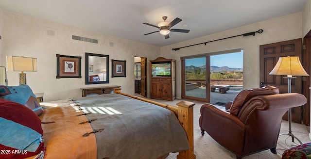 bedroom featuring access to outside, carpet flooring, visible vents, and a ceiling fan