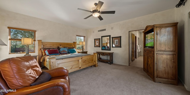 bedroom with light carpet, multiple windows, and visible vents