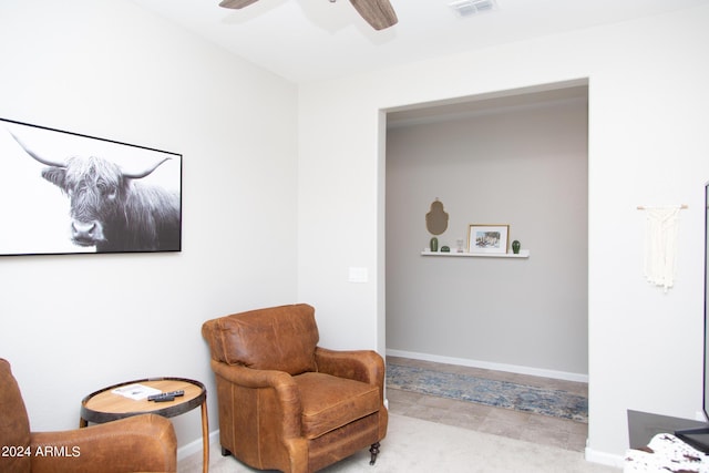 sitting room featuring ceiling fan, visible vents, and baseboards