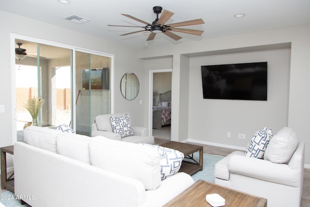 living area featuring ceiling fan, baseboards, visible vents, and recessed lighting