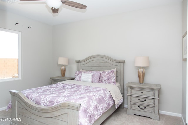 carpeted bedroom featuring visible vents, a ceiling fan, and baseboards