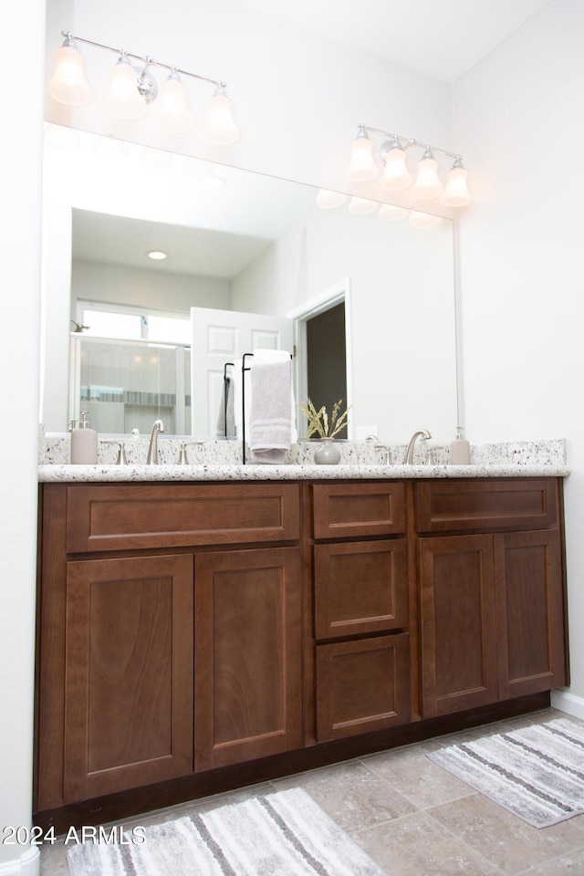 bathroom with double vanity and a sink