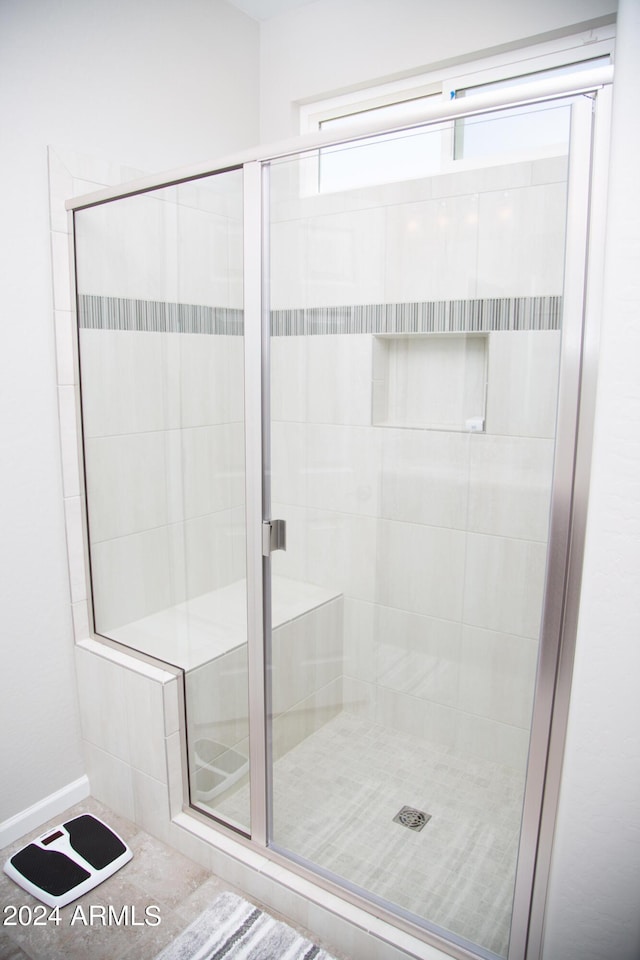 full bath featuring a shower stall