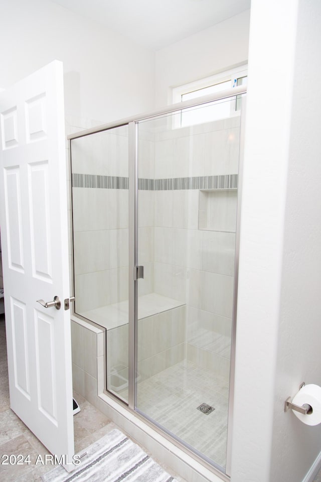 bathroom with a shower stall