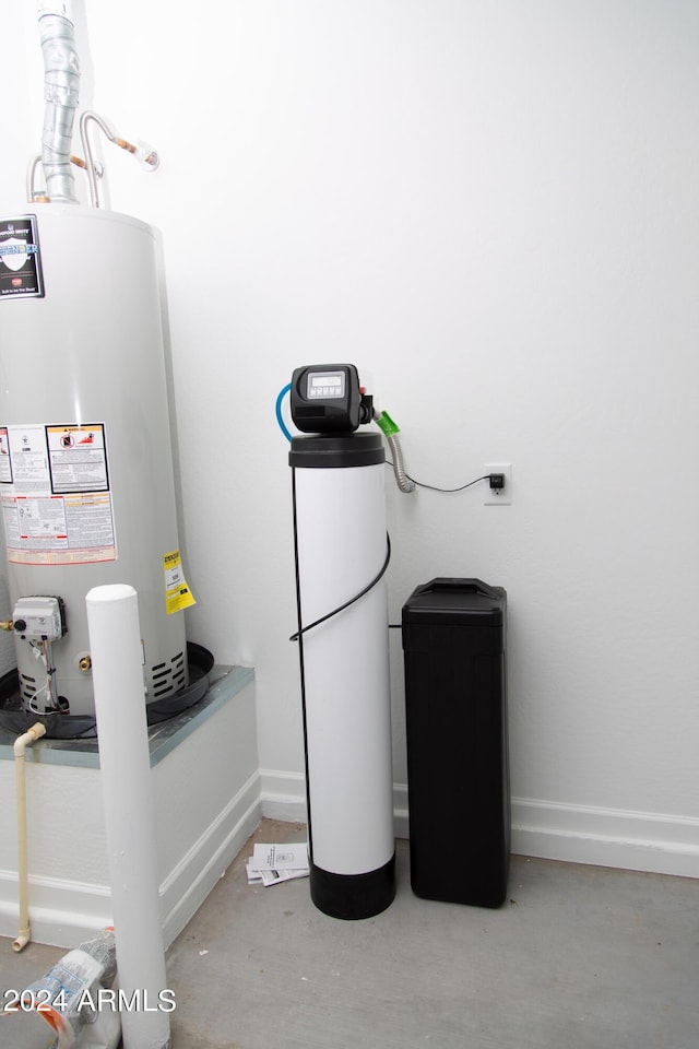 utility room with gas water heater