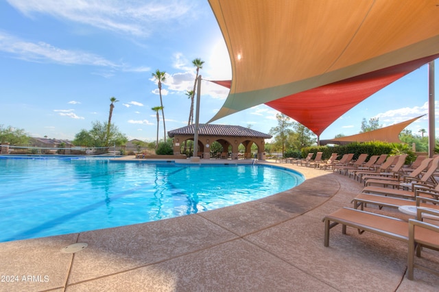 community pool with a patio area