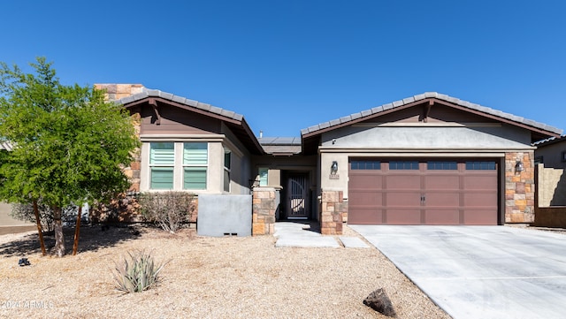 view of front of property with solar panels and a garage