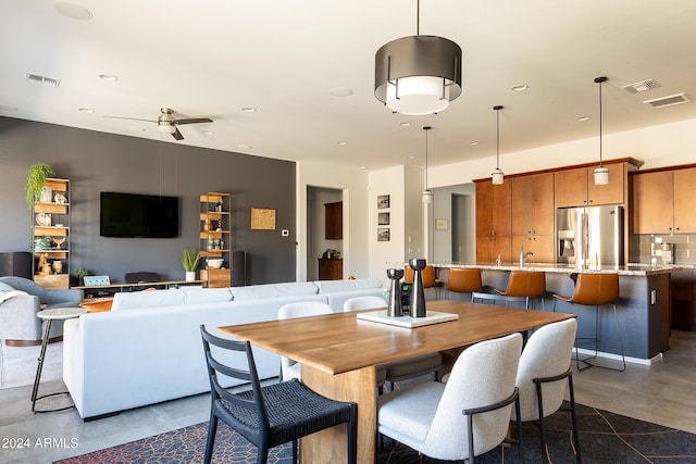 dining space featuring ceiling fan