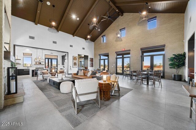 22553 S 204th Ct, Queen Creek, AZ 85142 - living room with high vaulted ceiling, wooden ceiling, beam ceiling, french doors, and concrete flooring