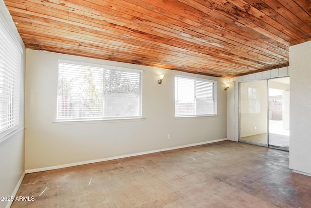 2227 N 57th Dr, Phoenix, AZ 85035 - empty room with wooden ceiling, baseboards, and concrete flooring