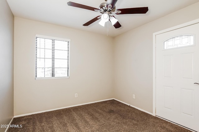 2227 N 57th Dr, Phoenix, AZ 85035 - empty room featuring plenty of natural light, dark carpet, ceiling fan, and baseboards