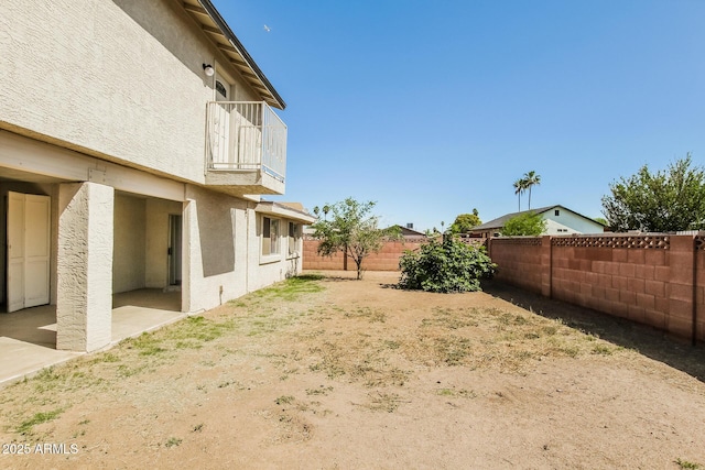 2227 N 57th Dr, Phoenix, AZ 85035 - fenced backyard with a balcony and a patio