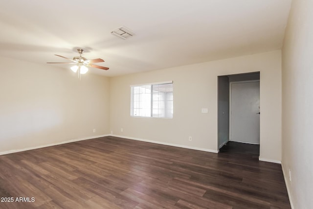 2227 N 57th Dr, Phoenix, AZ 85035 - empty room with ceiling fan, dark wood-style floors, and baseboards