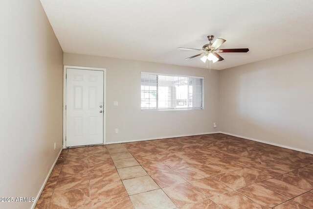 2227 N 57th Dr, Phoenix, AZ 85035 - spare room with a ceiling fan and baseboards