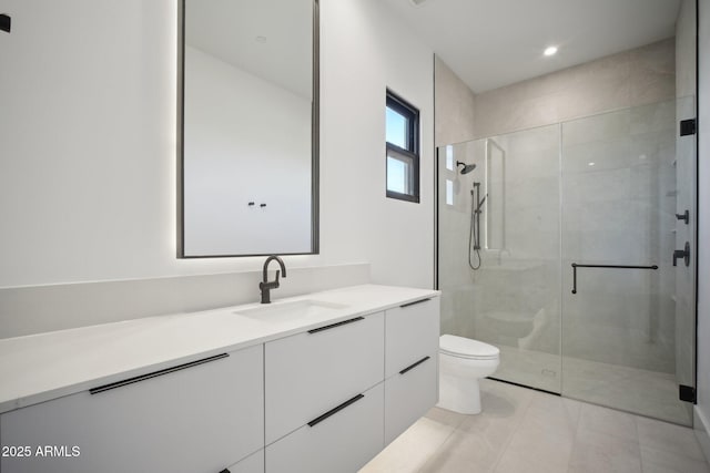 bathroom with tile patterned flooring, vanity, toilet, and a shower with shower door