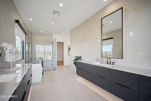 bathroom featuring tile patterned flooring and vanity