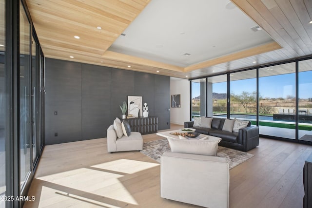 sunroom / solarium with a raised ceiling and wooden ceiling