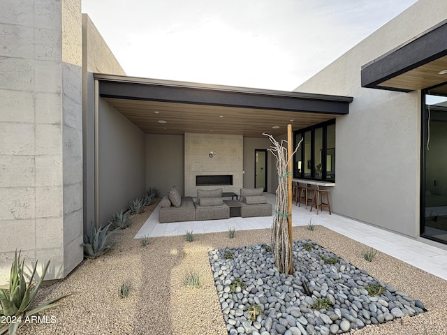 view of patio featuring an outdoor living space and exterior bar