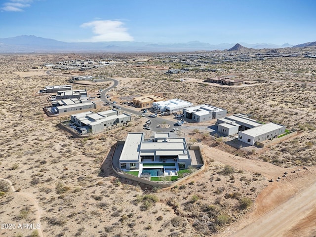 birds eye view of property with a mountain view