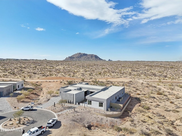 drone / aerial view featuring a mountain view