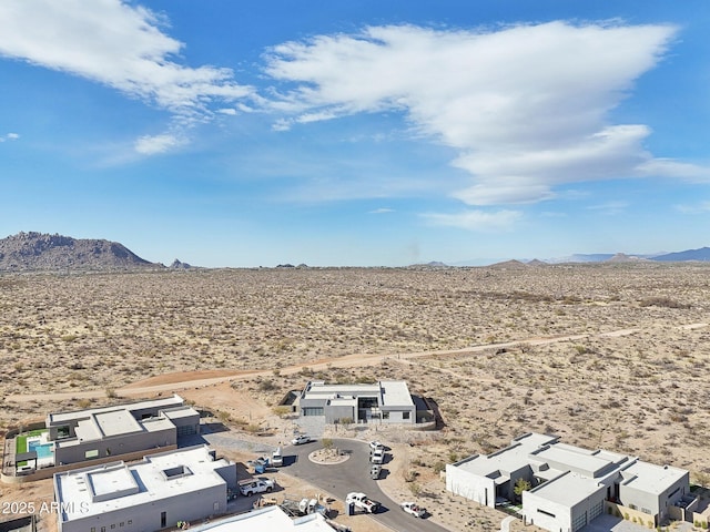 birds eye view of property with a mountain view