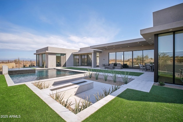 view of swimming pool with a lawn, outdoor lounge area, and a patio area