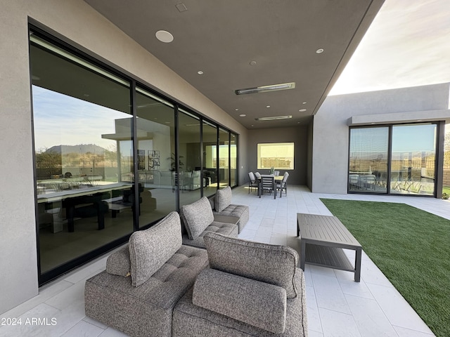 view of patio featuring a mountain view and an outdoor hangout area