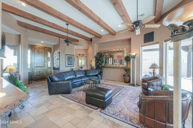 living room with beam ceiling and ceiling fan