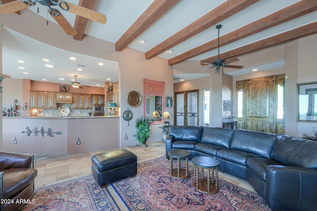 living room featuring beamed ceiling, ceiling fan, and french doors