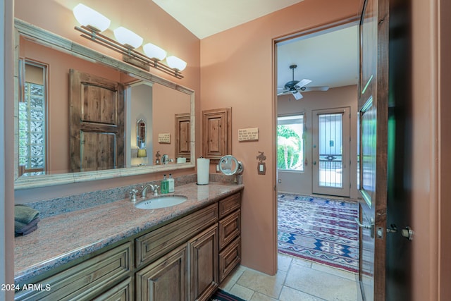 bathroom featuring vanity and ceiling fan