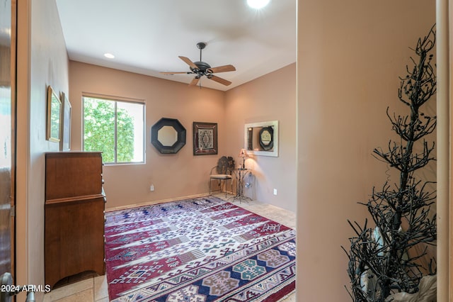 sitting room featuring ceiling fan and light tile patterned floors