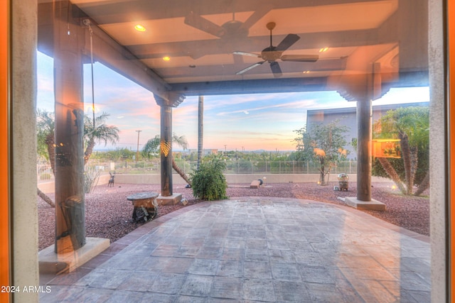 patio terrace at dusk with ceiling fan