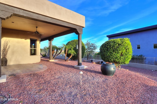 view of yard featuring a patio and ceiling fan