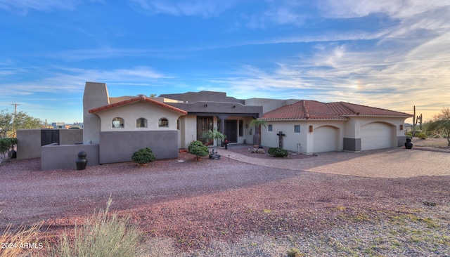 view of front of property with a garage