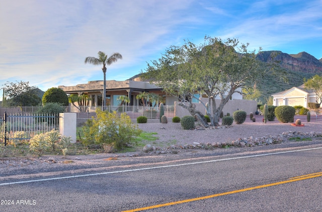 view of front of house with a garage and a mountain view