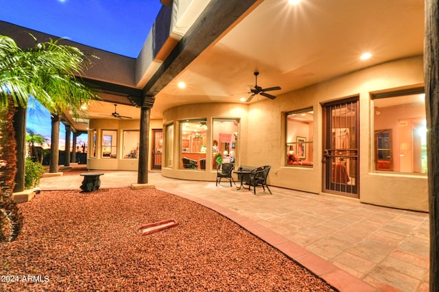 patio terrace at dusk with ceiling fan